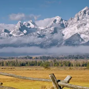 snowy mountains with grassland