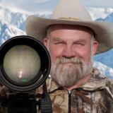 download-5 man standing with a camera